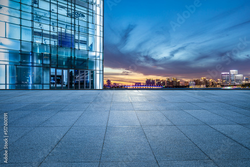 Empty floor and modern city skyline with building scenery at sunset in Suzhou, China. high angle vie